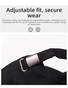Detail of adjustable metal buckle and twill fabric texture on black baseball cap