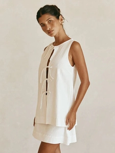 Chic white sleeveless tie-front top and A-line skirt set in textured cotton linen