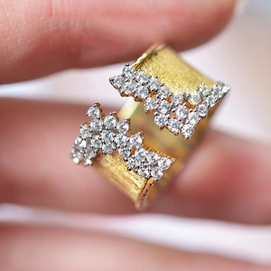 Luxurious gold-plated ring with brushed finish and sparkling micro-pave cubic zirconia