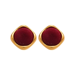 Vintage geometric gold-edged earrings with deep red velvet inlay on white background