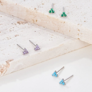 Detailed view of three pairs of S925 silver clover earrings with colorful zircon stones