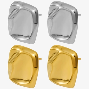 Detailed view of irregular 18k gold and silver stainless steel melted earrings