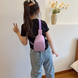 Kids purple mini crossbody chest bag with adjustable strap and dual zipper compartments