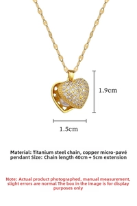 Detail of heart pendant featuring micro-pave zircons and white pearl on gold titanium chain