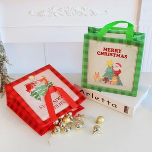 Christmas non-woven gift bags with Santa and reindeer prints in red and green plaid