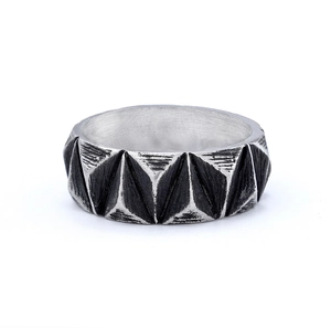 Detailed view of silver Celtic ring with vintage triangular geometric relief and blackened finish