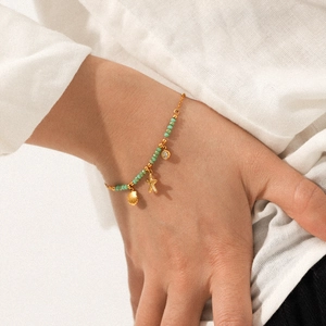 18K gold plated stainless steel bracelet with green stones, starfish and shell charms