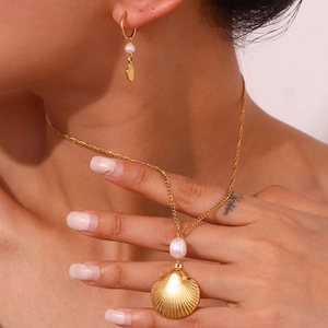 Elegant 18K gold plated necklace and earrings set with shell charms and white pearls