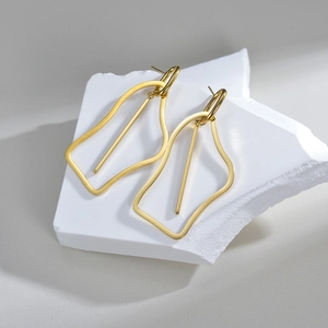 Minimalist irregular hollow geometric gold titanium steel earrings on a stone base