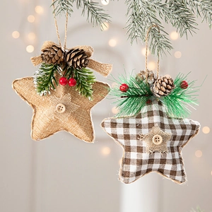 Linen Christmas star ornaments with pine cones, red berries and festive pine needle accents