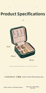 Detail view of emerald green velvet jewelry box with internal storage compartments and size