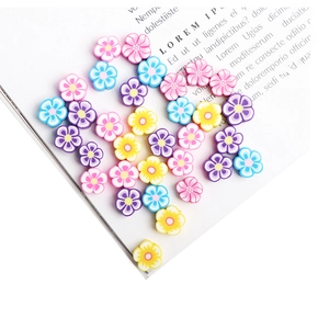 Macro shot of 10mm polymer clay flower beads for DIY jewelry making in assorted colors
