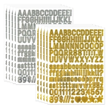 Detailed view of gold and silver cartoon alphabet and number sticker set for scrapbooking