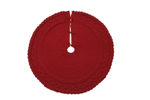 Détail du tapis de sapin de Noël tricoté rouge avec motifs de diamants et de vagues