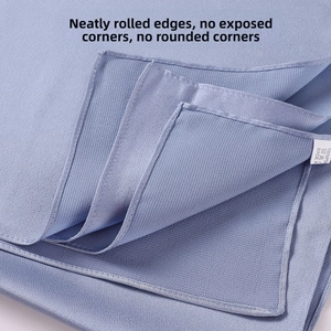 Detailed close-up of blue polyester chiffon shawl showing neat flat-stitched rolled edges