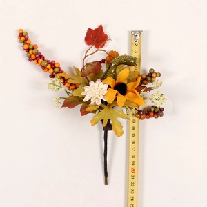 Detail showing artificial maple leaf branch with sunflower and berries measuring 25 cm