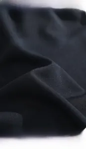 Macro detail of breathable ice silk fabric showing soft texture and smooth drape