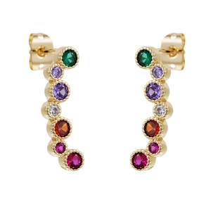Macro view of gold J-shaped earrings with seven multi-colored zircon stones