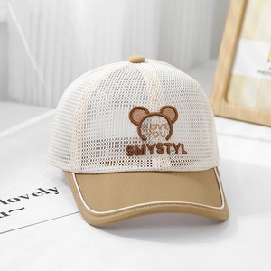 Detail of breathable mesh kids cap with beige and khaki panels and cute bear embroidery