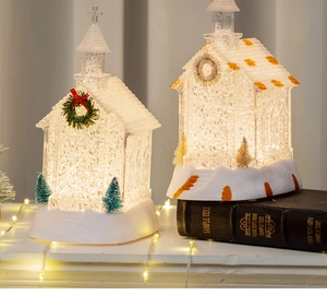 Detail of glowing LED Christmas church decoration with glitter and warm lights