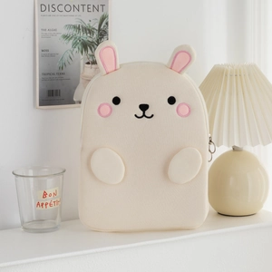 Close-up of soft rabbit-shaped tablet sleeve with plush texture and cute embroidery