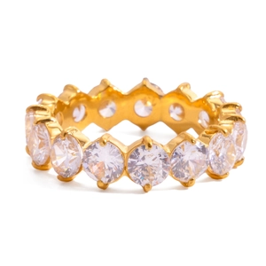 Detailed view of a gold-plated stainless steel ring featuring circular white zircons