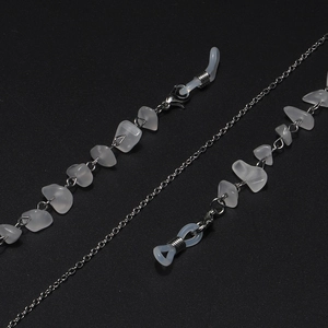 Detailed macro of crystal beads and silver chain link with silicone anti-slip loops