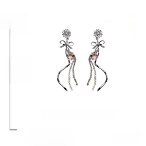 Detail view of long tassel earrings showing 9.5cm length and S925 silver needles