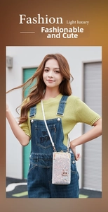 Close-up of sparkling sequin phone bag with cute bunny detail and white crossbody strap