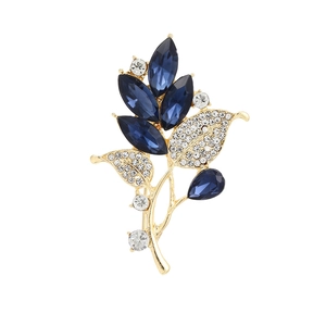 Elegant gold leaf brooch with navy blue marquise crystals and sparkling rhinestones