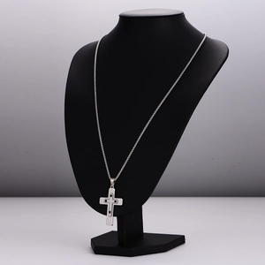 Polished silver stainless steel necklace with double-layer hollow cross pendant on a bust