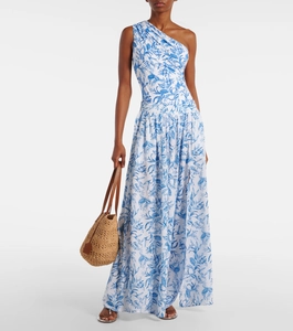 Detail of one-shoulder floral maxi dress with blue botanical print and a woven bucket bag