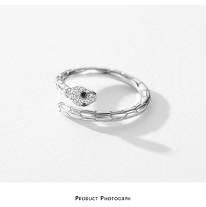 Detailed close-up of s925 silver snake ring with gemstone eyes and scale texture