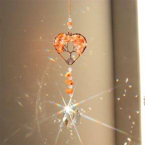 Detail of tree of life heart crystal suncatcher with copper wire and orange stones