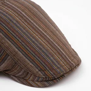 British vintage striped flat cap with extended wide brim and brown textured fabric