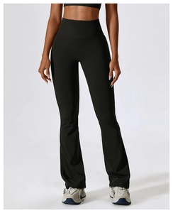 Detail showing the high waistband and flared cuffs of these black yoga trousers