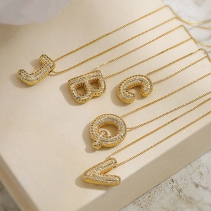 Gold plated necklaces with sparkling zircon-set initial pendants A, B, C, J, and Q