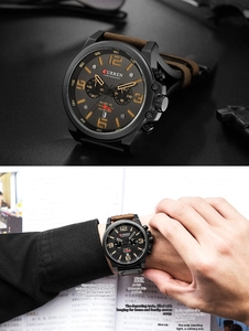 Detail of multi-functional men's quartz watch with chronograph sub-dials and brown leather strap