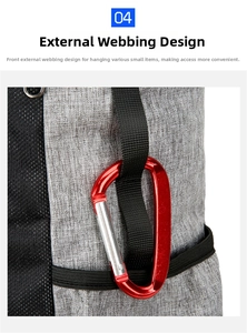 Detail view of front daisy chain webbing system with a red metal carabiner on travel backpack