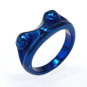 Detailed close-up of blue frog-shaped ring with polished metallic finish and funny design