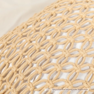 Close-up of handmade woven cotton rope bag with hollow grid pattern and white lining