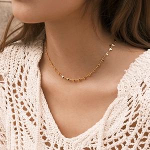 Minimalist handmade 18K gold plated copper heart choker necklace on female model