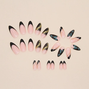 Almond press-on nails with black French tips, gold glitter, and blue butterfly designs
