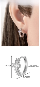 Detailed view of geometric cross hoop earring with size measurements and ear display