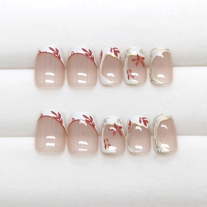 Handmade cream French press-on nails with red flowers and elegant gold trim