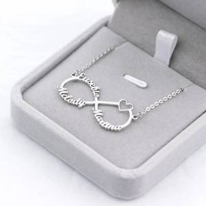 Macro shot of custom three-name infinity necklace in silver color for personalized gifts