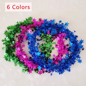Green, rose and blue star tinsel garlands for Christmas tree and festive party decoration
