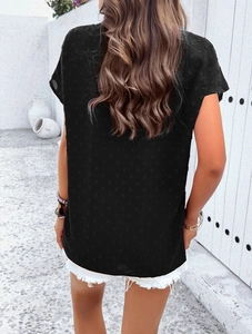 Detail view of the black short-sleeve top with elegant 3D dot texture on back