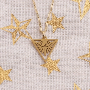 Detailed close-up of gold stainless steel triangle pendant with Evil Eye engraving