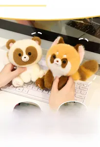 Close-up of soft plush raccoon and fox stuffed animals on a warm office desk setting